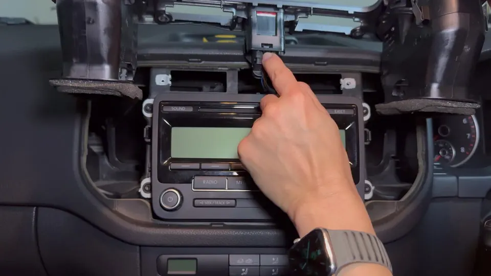 Pressing the clip to release the hazard switch