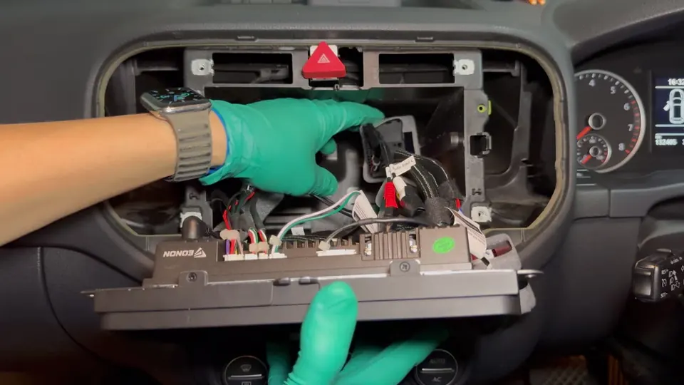 Pushing the wiring harness into the dashboard cavity